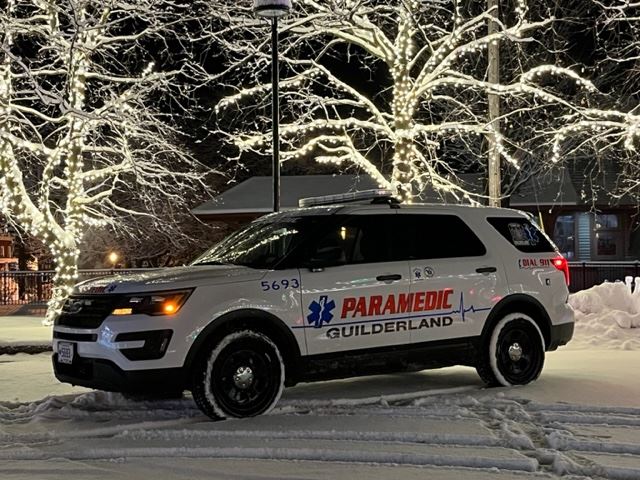 Photo of a paramedic vehicle at night in the snow 