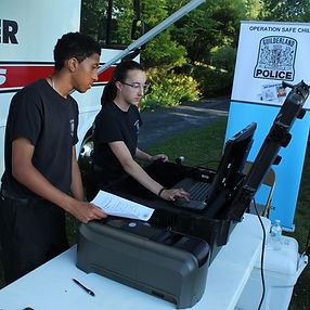 Officers Making Identification Cards for Children