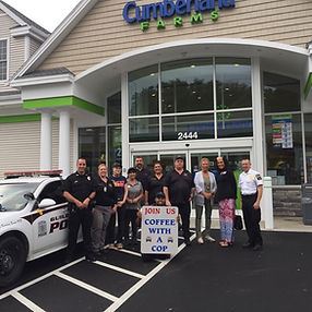 Members of the Community Meeting with Officers for the Coffee with a Cop Program
